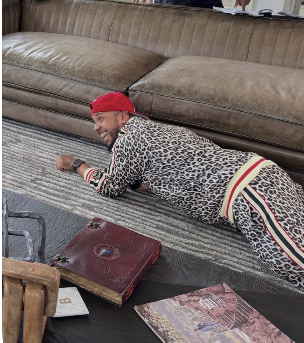 A playful moment between takes beside the sofa